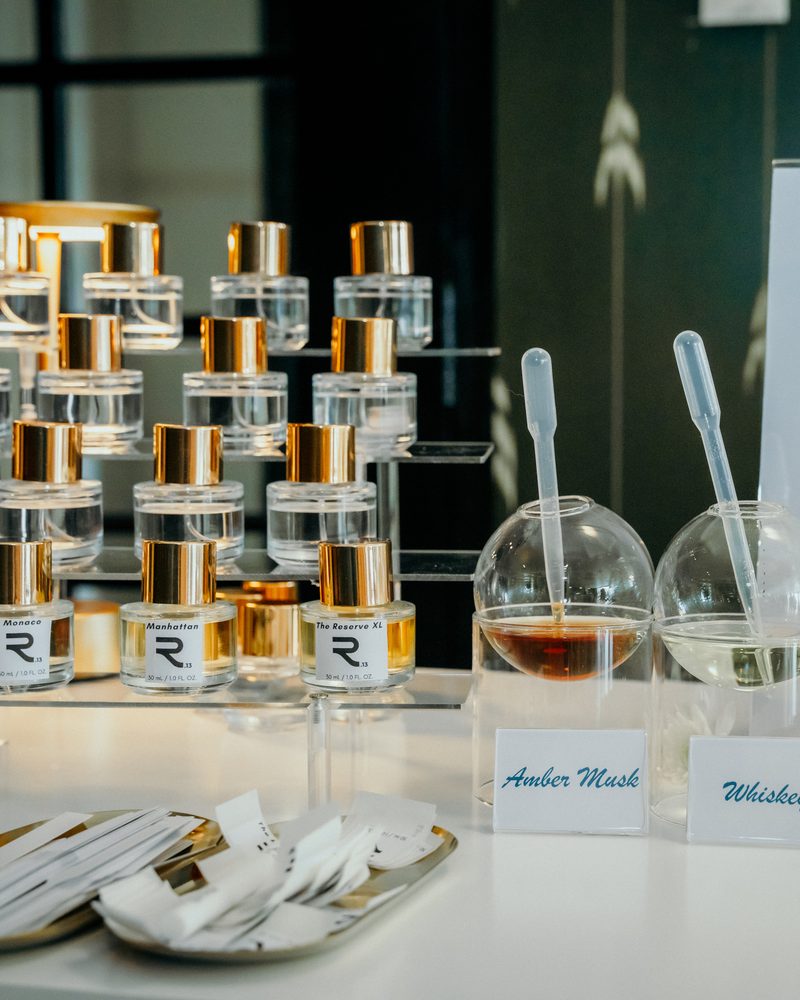 Signature fragrance bottles and blending vessels on the cart